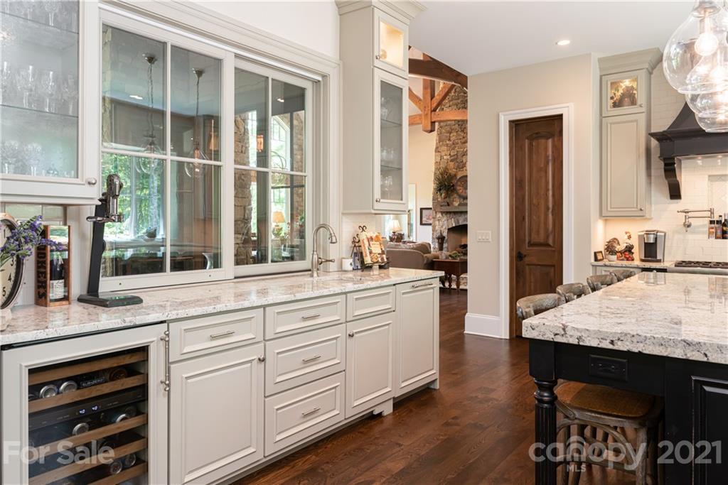 301 Flying Dutchman Road Sylva, NC 28779 - Photo 23 of 48 a kitchen with stainless steel appliances granite countertop a stove and a sink