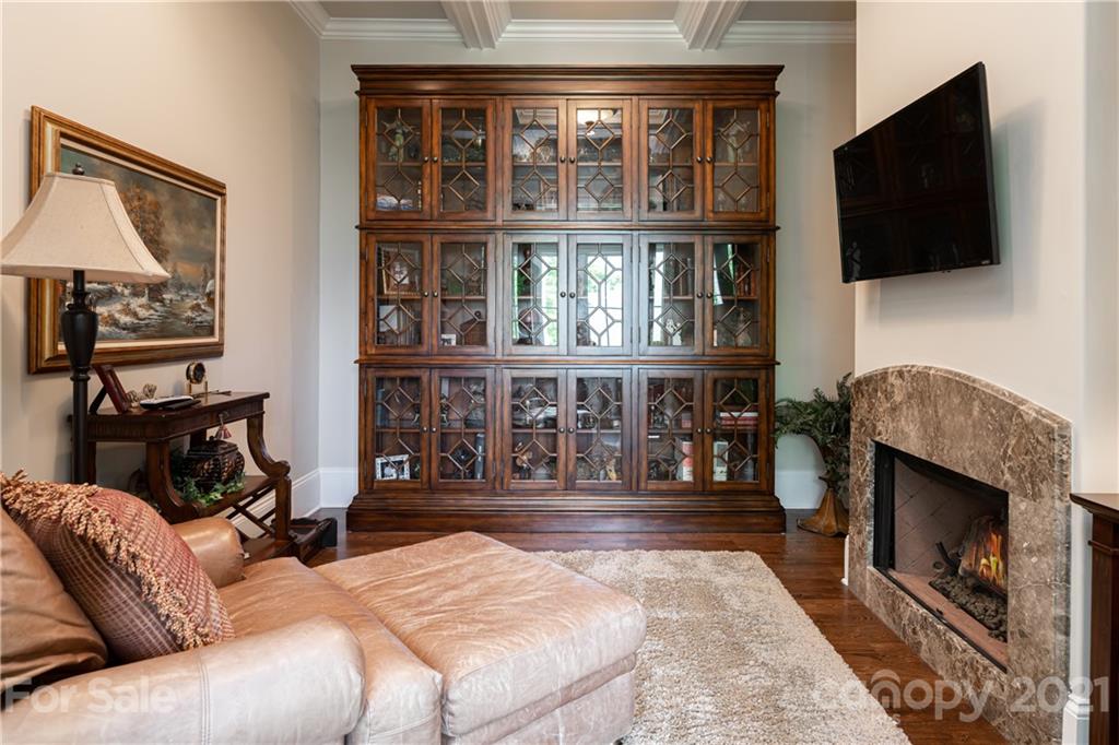 301 Flying Dutchman Road Sylva, NC 28779 - Photo 25 of 48 a living room with furniture a flat screen tv and a fireplace