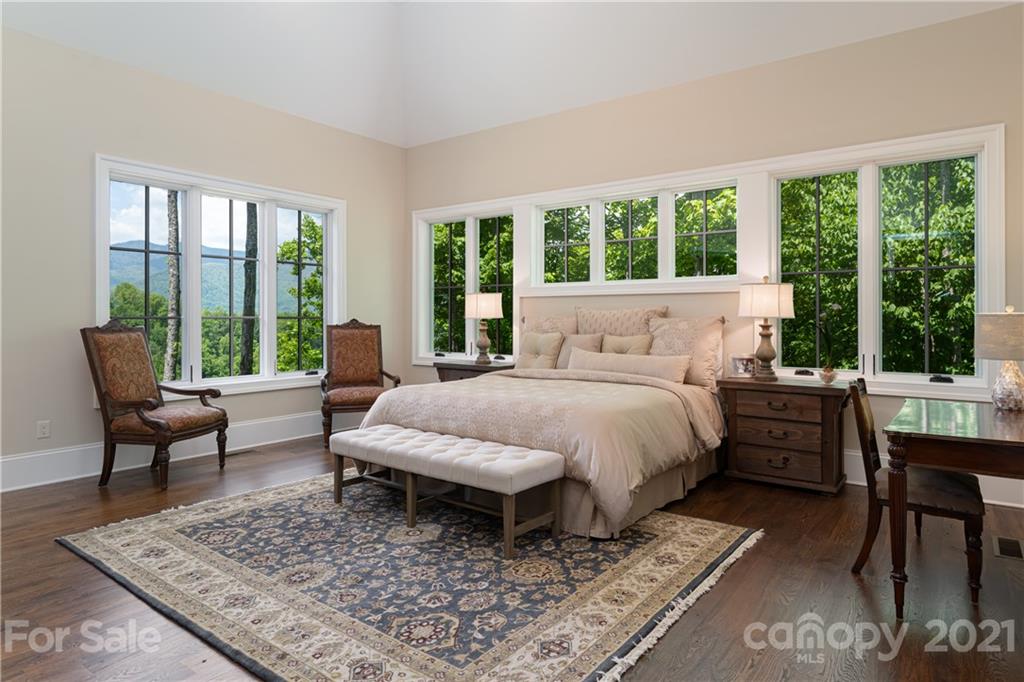 301 Flying Dutchman Road Sylva, NC 28779 - Photo 27 of 48 a bed sitting in a bedroom next to a window