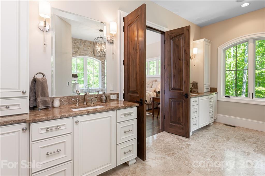 301 Flying Dutchman Road Sylva, NC 28779 - Photo 28 of 48 a kitchen with a sink and cabinets