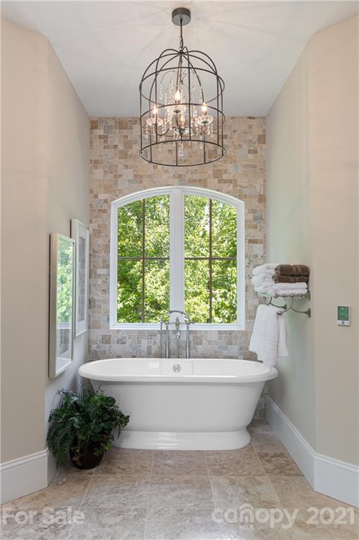 301 Flying Dutchman Road Sylva, NC 28779 - Photo 30 of 48 a bathroom with a bathtub and window