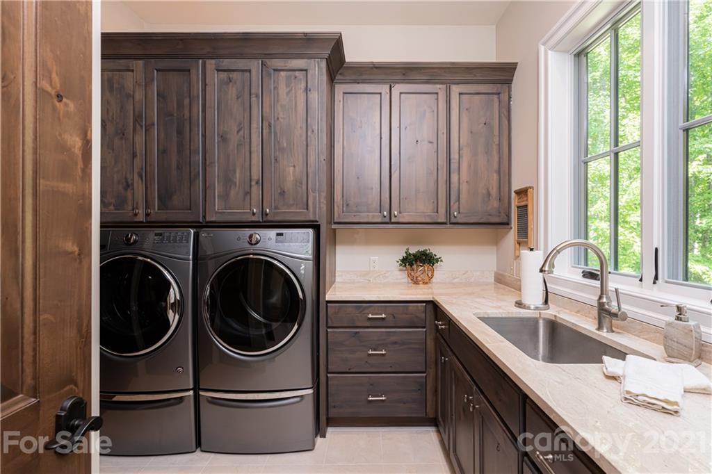 301 Flying Dutchman Road Sylva, NC 28779 - Photo 32 of 48 a utility room with sink dryer and washer