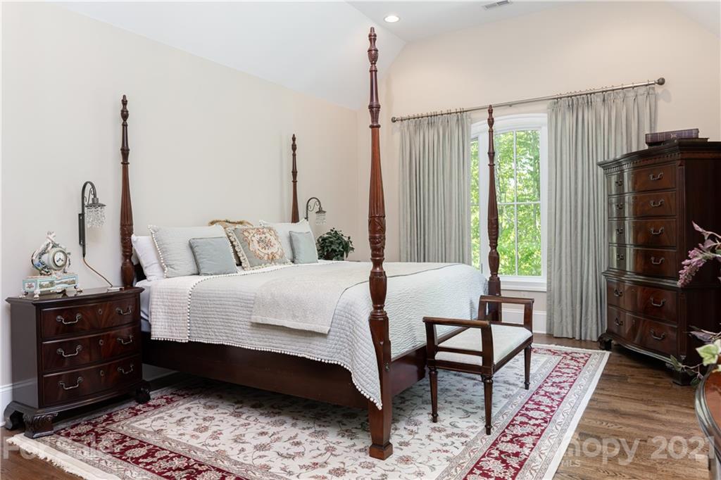 301 Flying Dutchman Road Sylva, NC 28779 - Photo 38 of 48 a bedroom with a bed a lamp and a closet