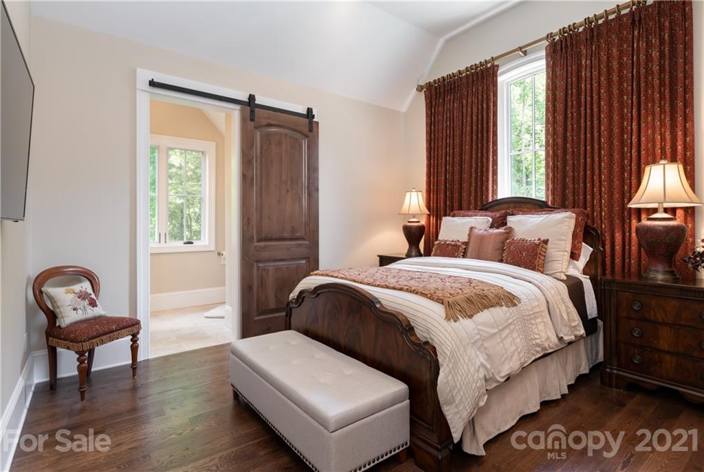 301 Flying Dutchman Road Sylva, NC 28779 - Photo 41 of 48 a bedroom with a bed and a chair