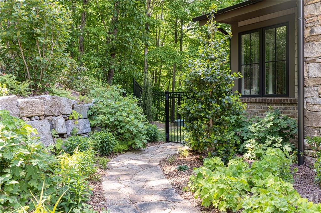 301 Flying Dutchman Road Sylva, NC 28779 - Photo 47 of 48 a view of a backyard with potted plants and large trees
