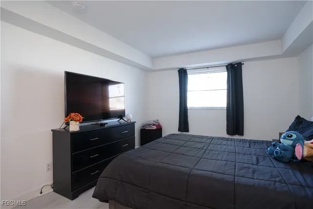 a kitchen with granite countertop stainless steel appliances a refrigerator a sink a stove a table and chairs