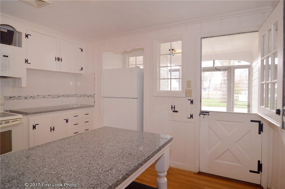 100 King Philip Road Pawtucket, RI 02861 - Photo 23 of 38 Kitchen with dutch door to breezeway