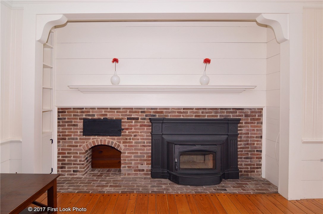100 King Philip Road Pawtucket, RI 02861 - Photo 10 of 38 Fireplace with wood stove insert