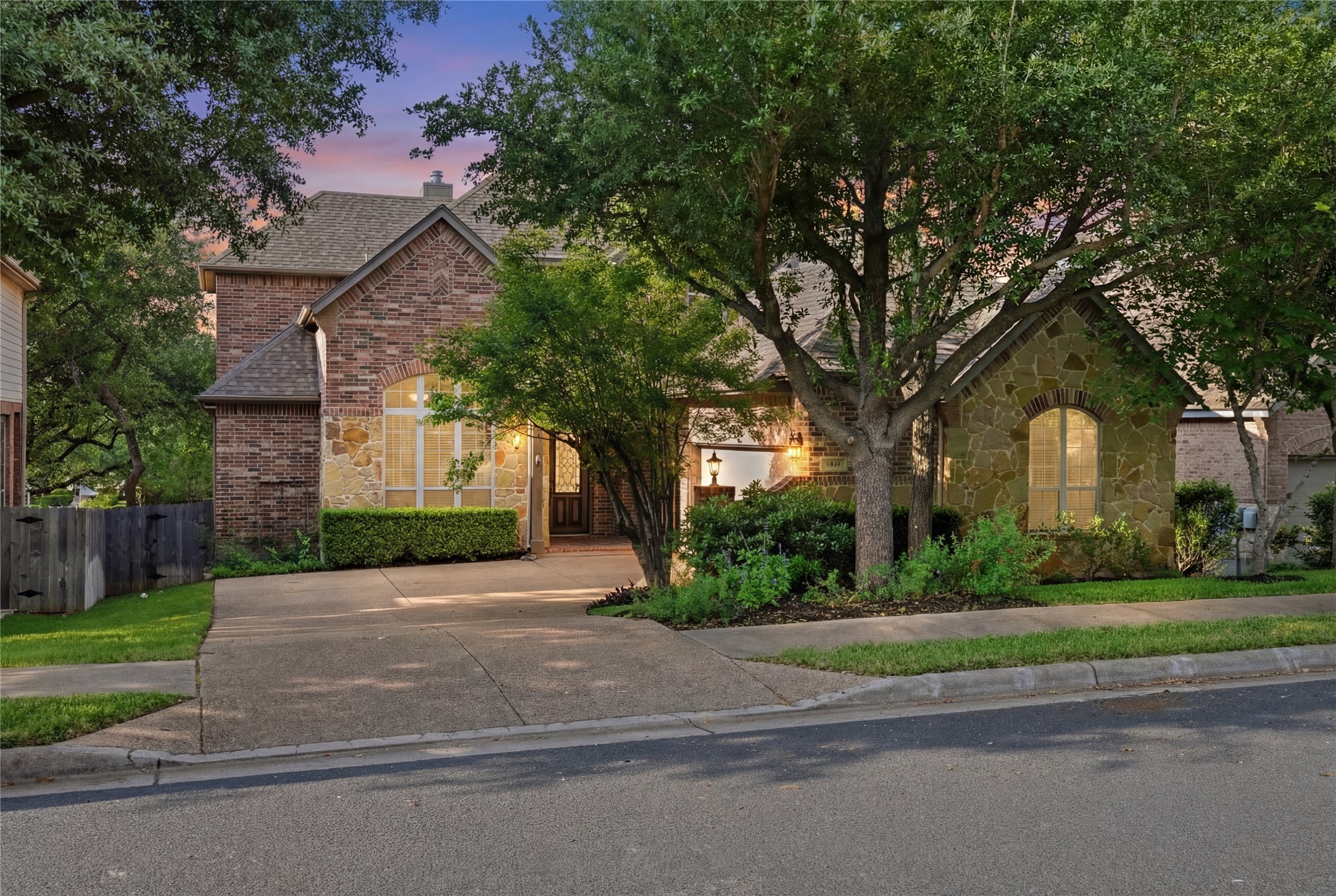 3519 Alexandrite Way Round Rock, TX 78681 - Photo 1 of 1 The property features a brick and stone facade, a gabled roof, and an arched window