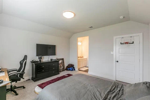 a bedroom with a workspace