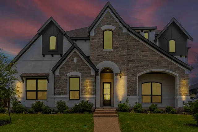 a front view of a house with garden