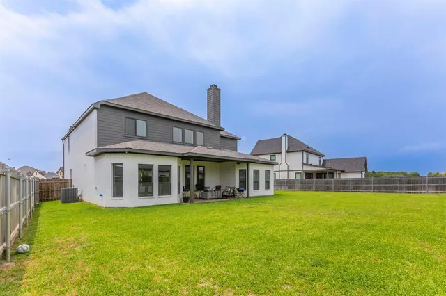 a view of a swimming pool with outdoor seating