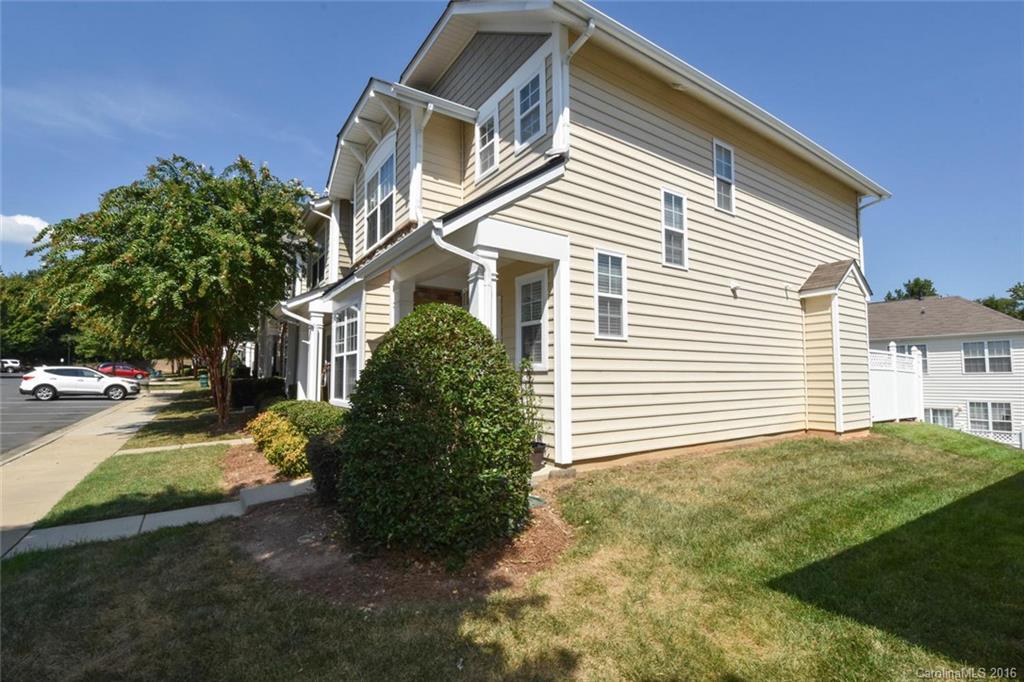 822 Gentlewinds Court, Unit 143 Fort Mill, SC 29708 - Photo 2 of 21 a view of a house with backyard and plants