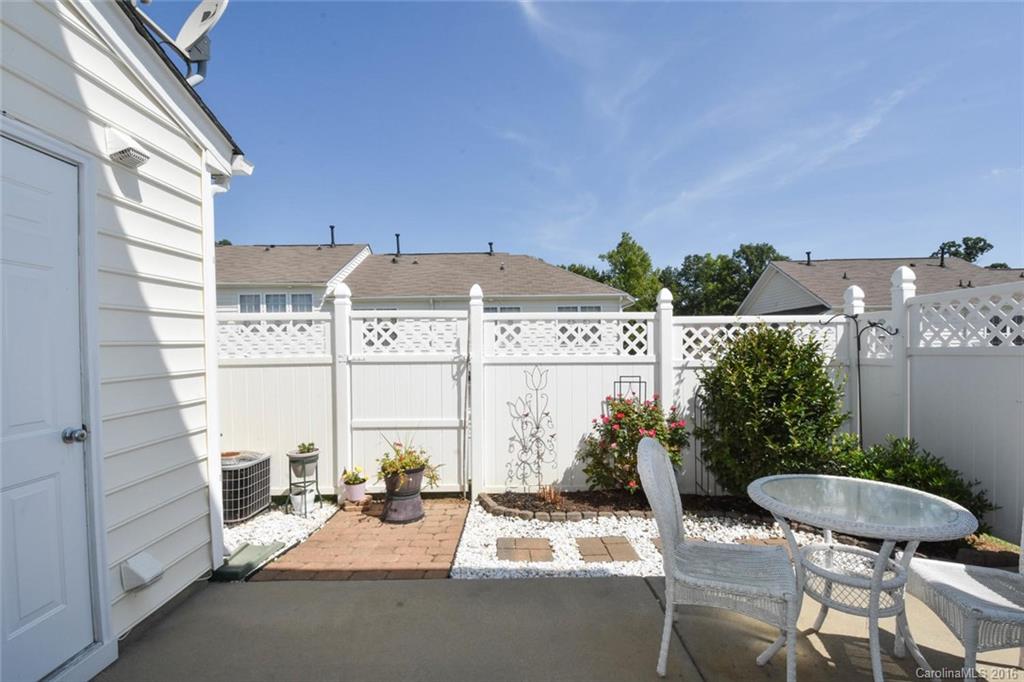 822 Gentlewinds Court, Unit 143 Fort Mill, SC 29708 - Photo 16 of 21 a view of a chairs and table in patio