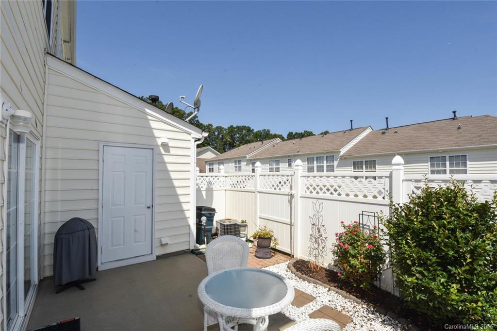 822 Gentlewinds Court, Unit 143 Fort Mill, SC 29708 - Photo 17 of 21 a balcony with table and chairs