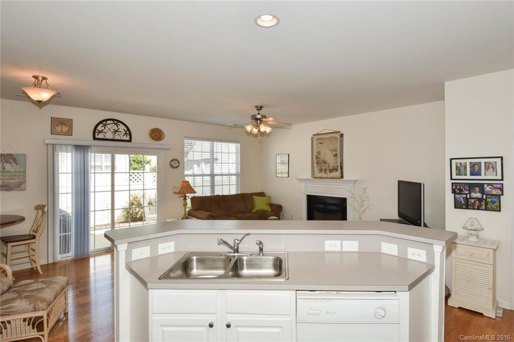 822 Gentlewinds Court, Unit 143 Fort Mill, SC 29708 - Photo 8 of 21 a kitchen with stainless steel appliances granite countertop a sink and a granite counter tops with a large window