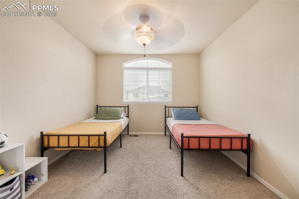 4966 Spokane Way Colorado Springs, CO 80911 - Photo 17 of 35 a living room with furniture and a window