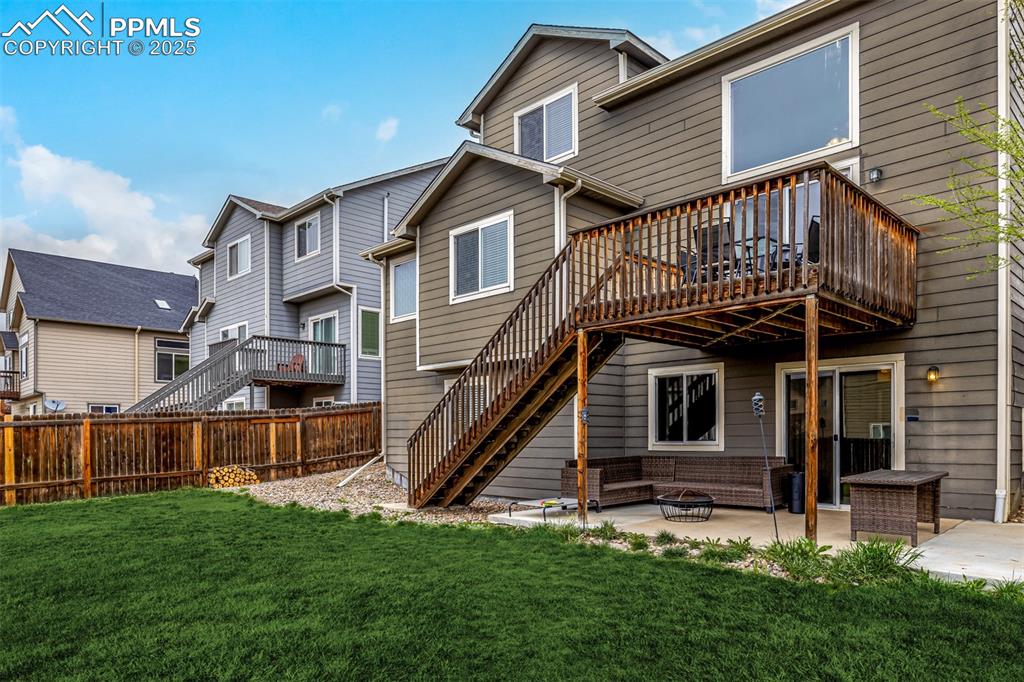 4966 Spokane Way Colorado Springs, CO 80911 - Photo 27 of 35 a view of a house with a yard