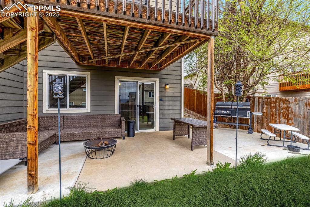 4966 Spokane Way Colorado Springs, CO 80911 - Photo 28 of 35 a view of a house with a patio and a yard