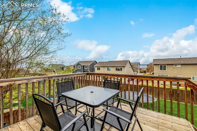 a view of a balcony with furniture