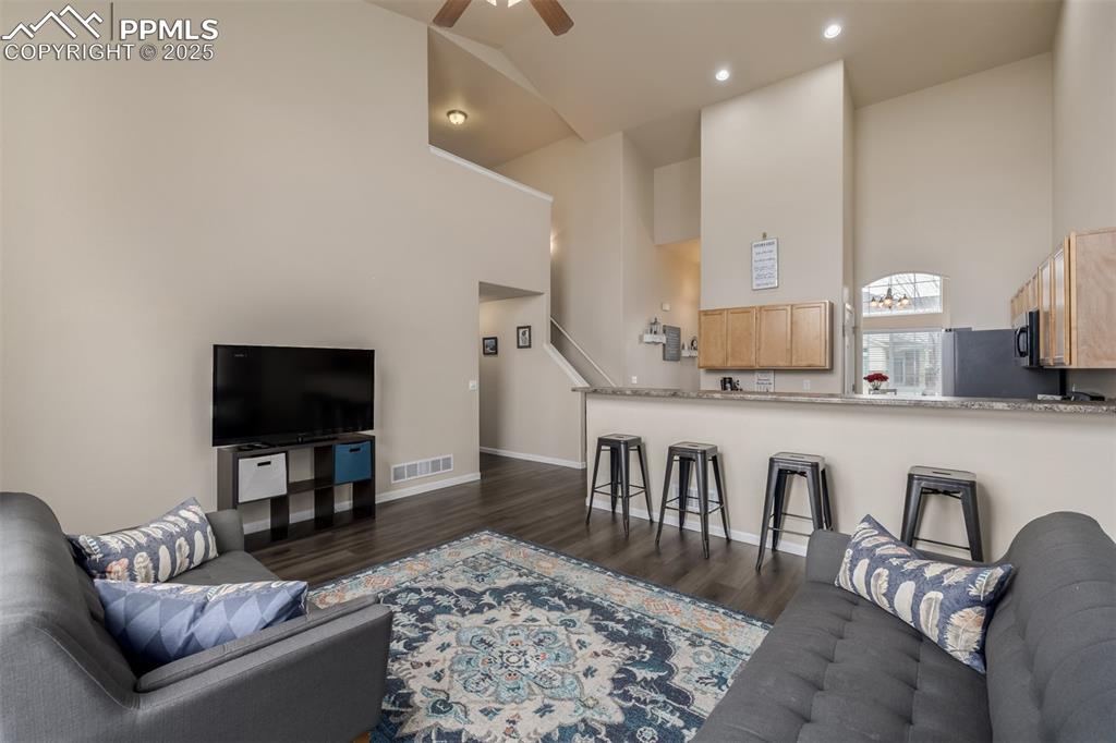 4966 Spokane Way Colorado Springs, CO 80911 - Photo 6 of 35 a living room with furniture and a flat screen tv