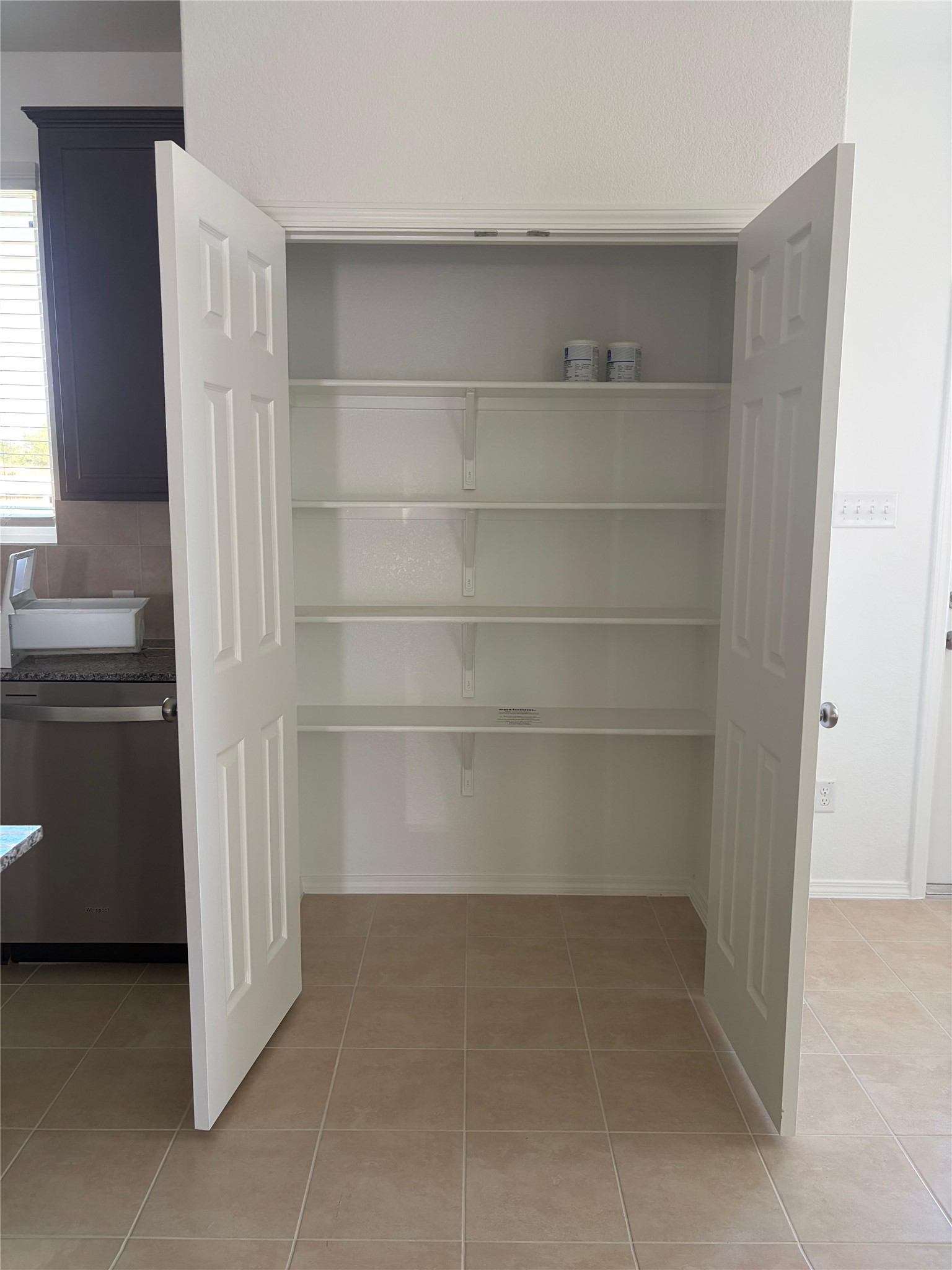545 Henry Milton Road Georgetown, TX 78626 - Photo 26 of 33 Ample built-in shelving provides plenty of storage space within this walk-in kitchen pantry.