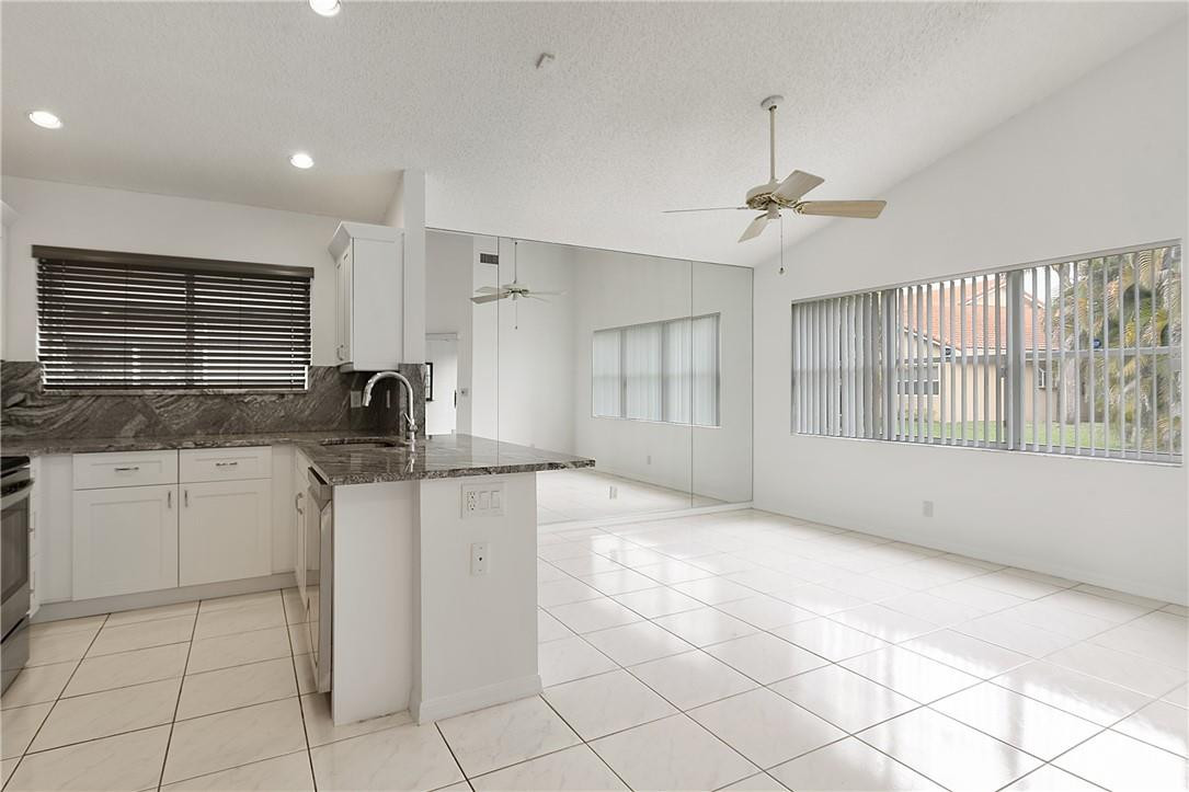11095 Autoro Court, Unit 11095 Boca Raton, FL 33498 - Photo 14 of 45 Family room off of kitchen.