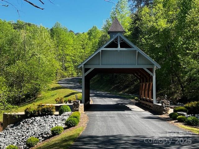 Lot 37 North Mountain Ln Mill Spring Mill Spring, NC 28756 - Photo 15 of 23 a front view of a house with a yard