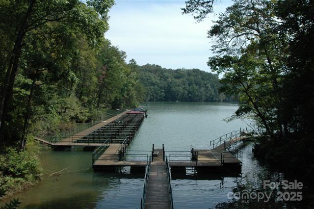 Lot 37 North Mountain Ln Mill Spring Mill Spring, NC 28756 - Photo 16 of 23 a view of a lake with boats and trees in the background