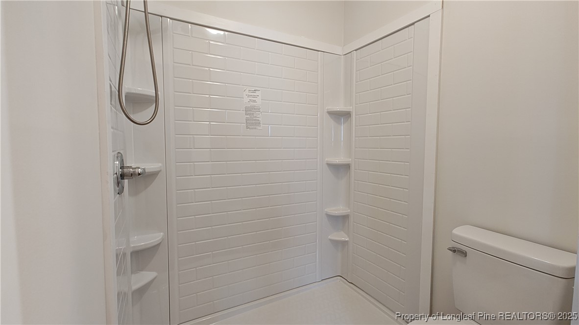 704 South Bethel Road Raeford, NC 28376 - Photo 18 of 32 a bathroom with a shower