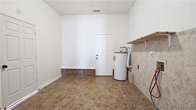 a view of a storage & utility room with closet