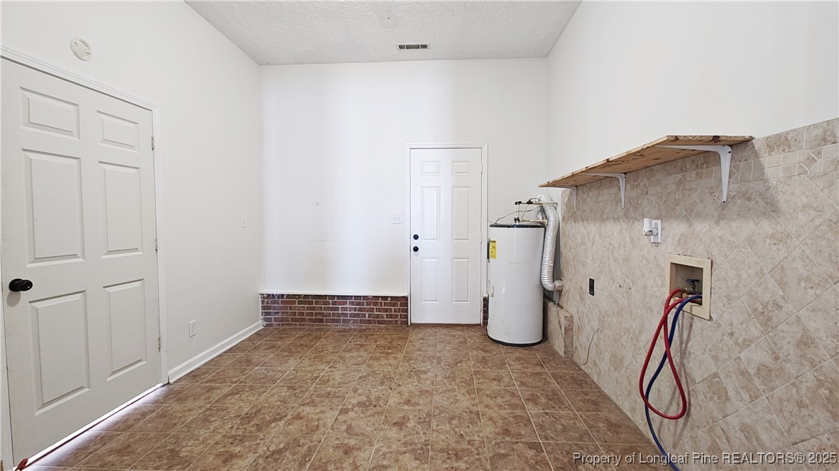 704 South Bethel Road Raeford, NC 28376 - Photo 25 of 32 a view of a storage & utility room with closet