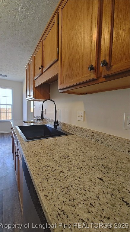 704 South Bethel Road Raeford, NC 28376 - Photo 8 of 32 a kitchen with granite countertop a sink a stove and cabinets