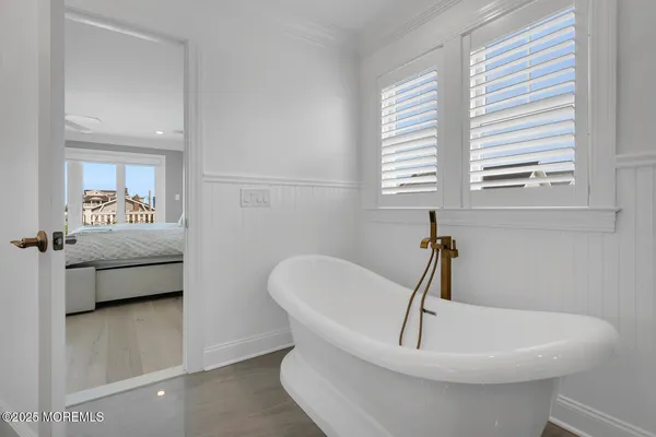 a view of livingroom with furniture wooden floor and windows
