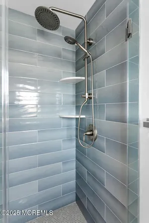 an aerial view of multiple houses with a yard