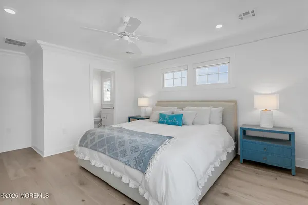 a kitchen with stainless steel appliances granite countertop a stove a sink and a white cabinets