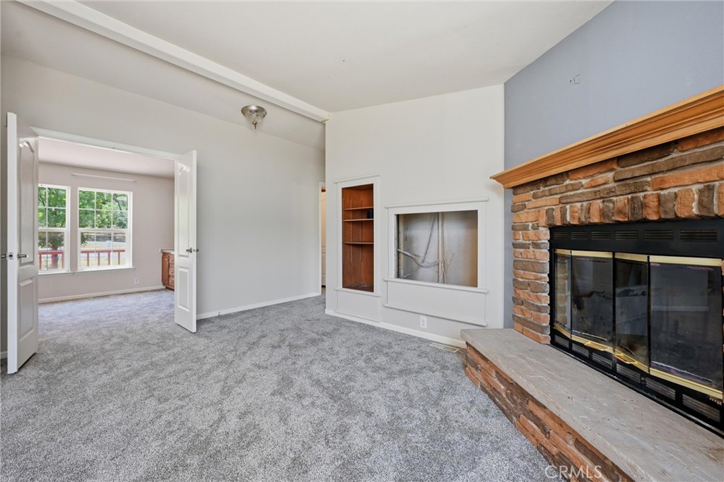 2860 Spring Valley Road Clearlake Oaks, CA 95423 - Photo 12 of 38 a view of empty room with window and fireplace