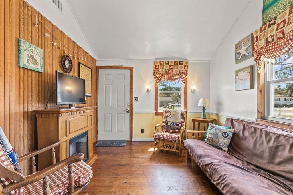 17 Wixon Road Dennis, MA 02639 - Photo 11 of 25 a living room with furniture and a flat screen tv