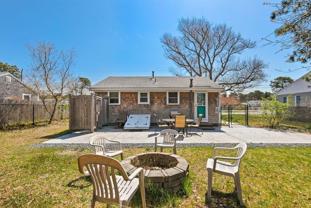 17 Wixon Road Dennis, MA 02639 - Photo 3 of 25 a swimming pool with outdoor seating and yard