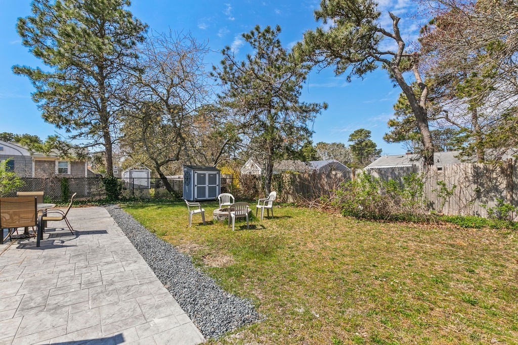 17 Wixon Road Dennis, MA 02639 - Photo 7 of 25 a view of a swimming pool with a patio