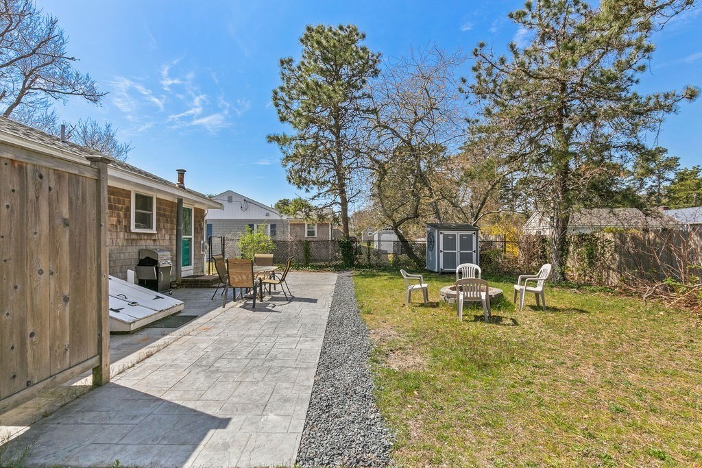17 Wixon Road Dennis, MA 02639 - Photo 8 of 25 a view of a park with bench and trees