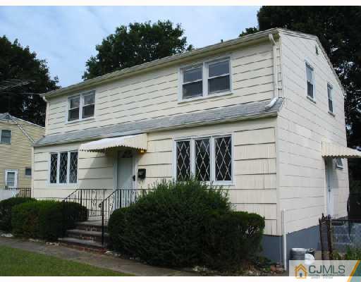 24 Stockton Road New Brunswick, NJ 08901 - Photo 1 of 10 a front view of a house with a garden
