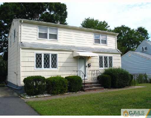 24 Stockton Road New Brunswick, NJ 08901 - Photo 2 of 10 a front view of a house with a garden