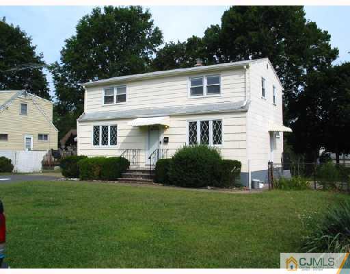 24 Stockton Road New Brunswick, NJ 08901 - Photo 8 of 10 a front view of a house with a garden and yard