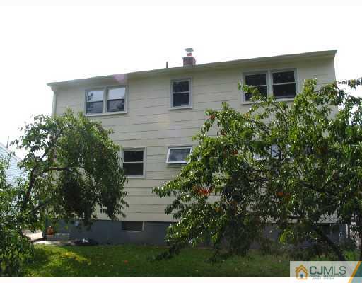 24 Stockton Road New Brunswick, NJ 08901 - Photo 10 of 10 a front view of house with yard and trees