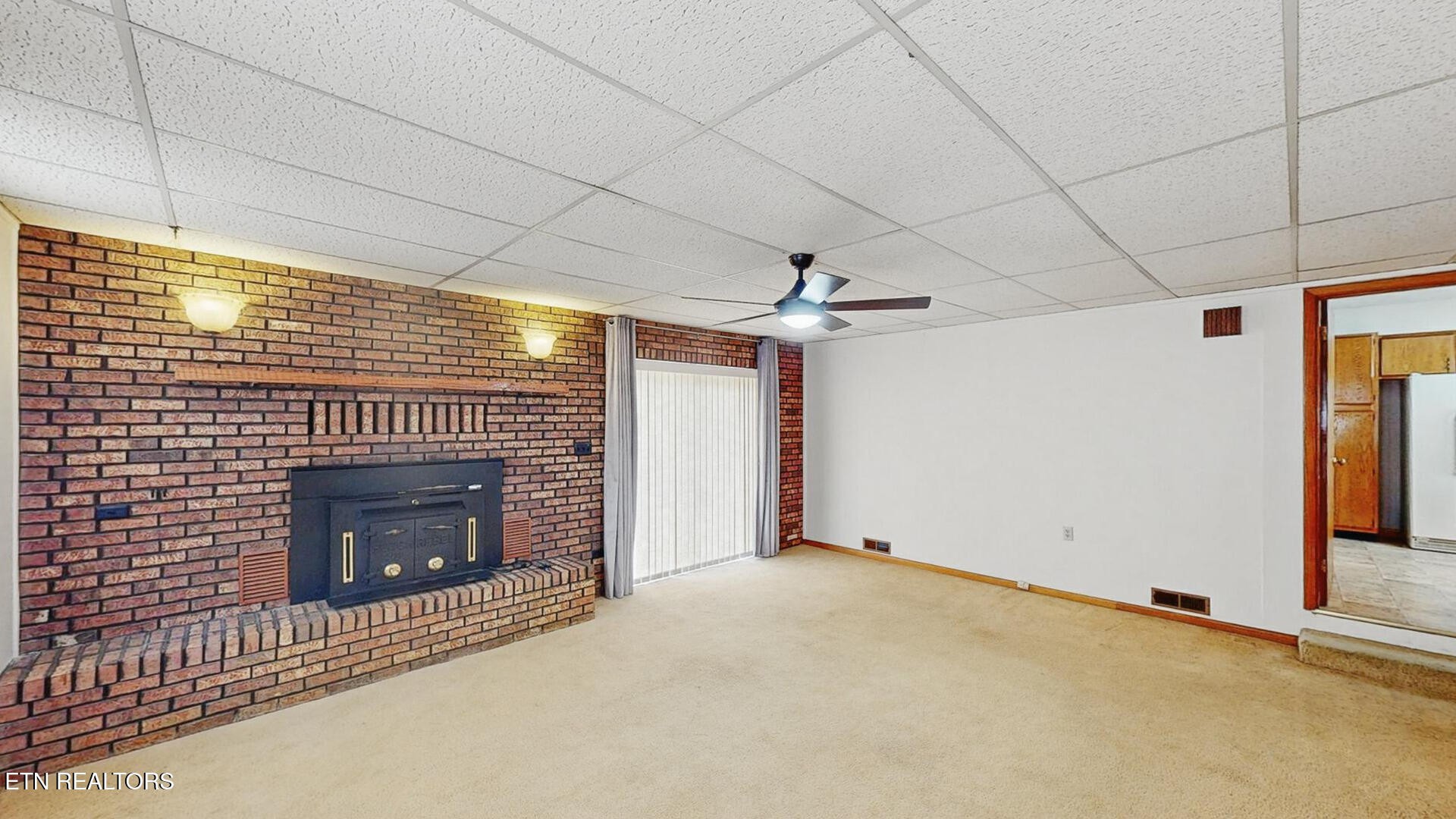 4004 Deerfield Road Knoxville, TN 37921 - Photo 12 of 34 a view of an empty room with a fireplace