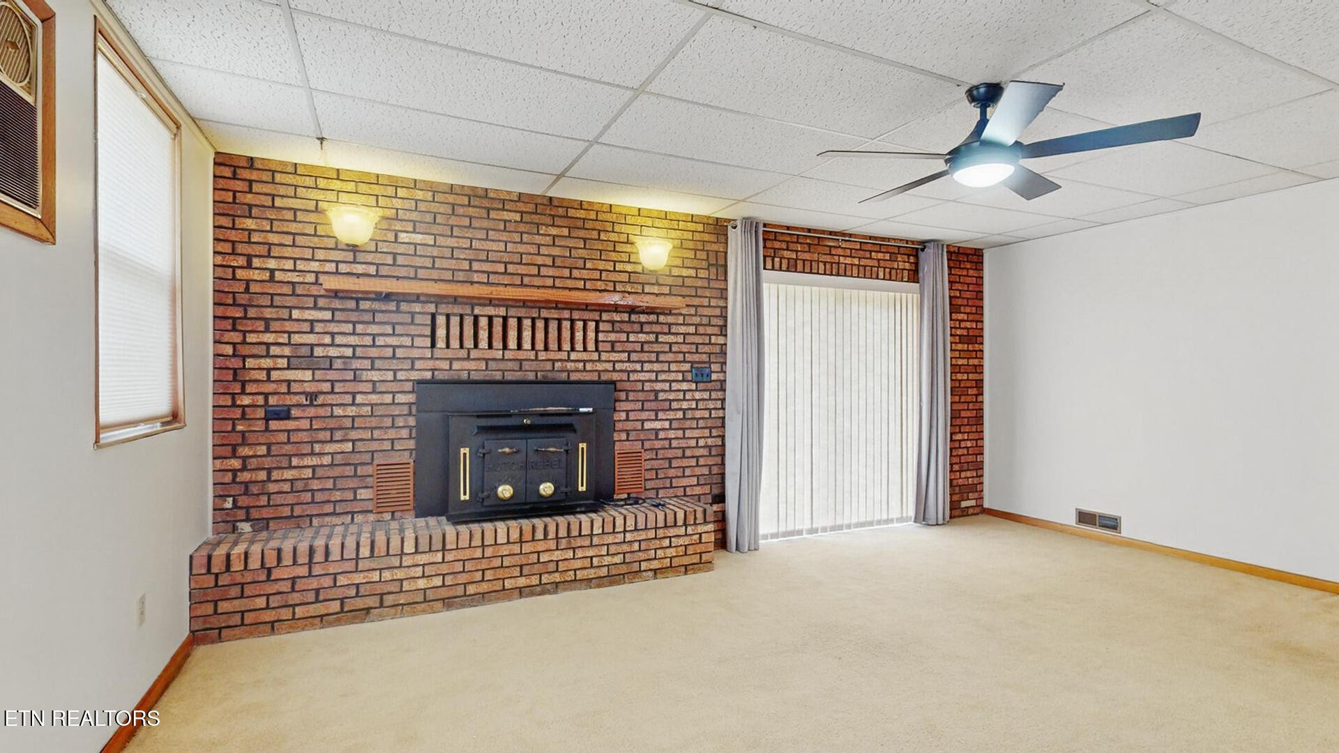 4004 Deerfield Road Knoxville, TN 37921 - Photo 13 of 34 a view of an empty room with a fireplace