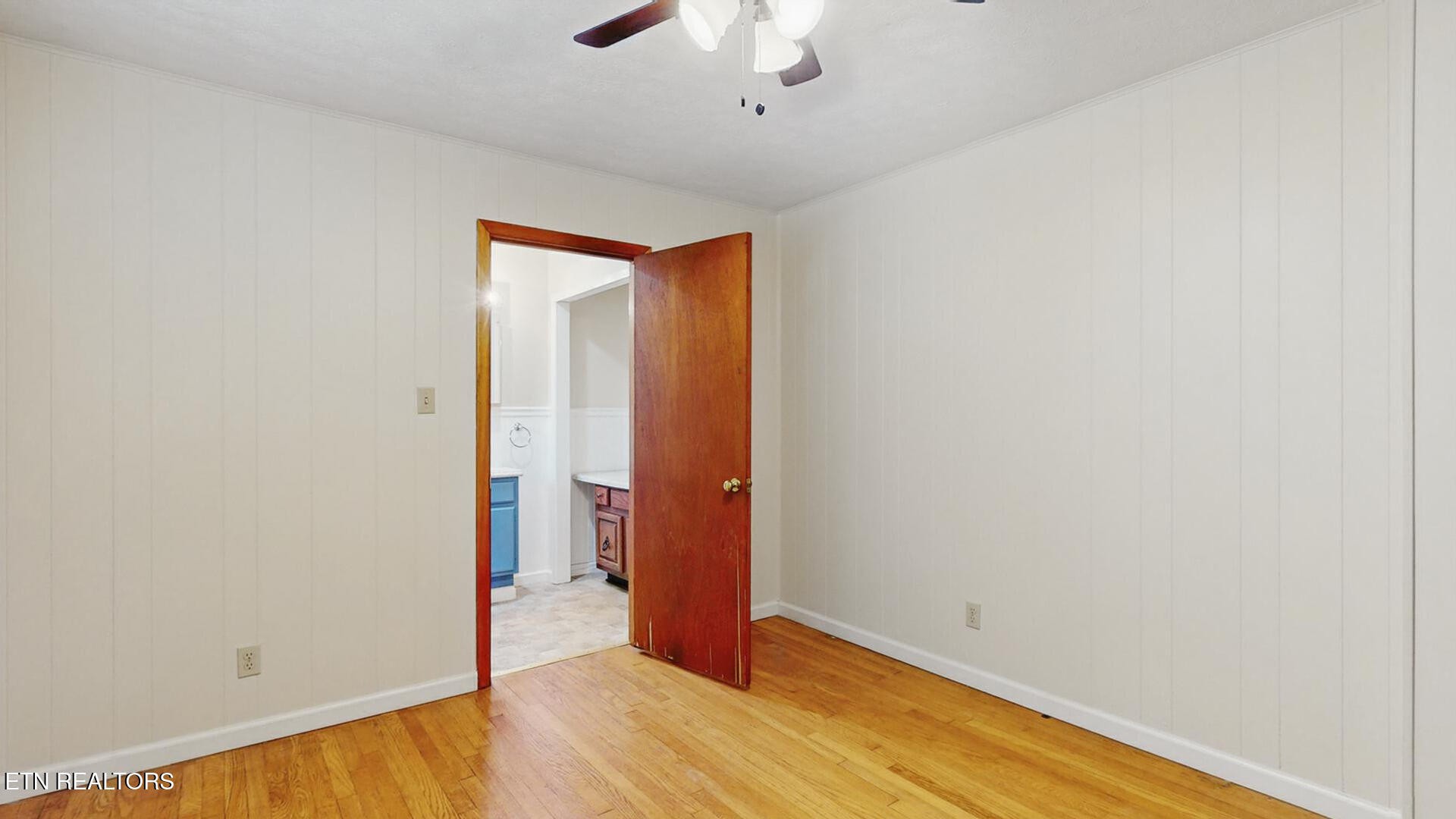 4004 Deerfield Road Knoxville, TN 37921 - Photo 17 of 34 a view of an empty room with wooden floor
