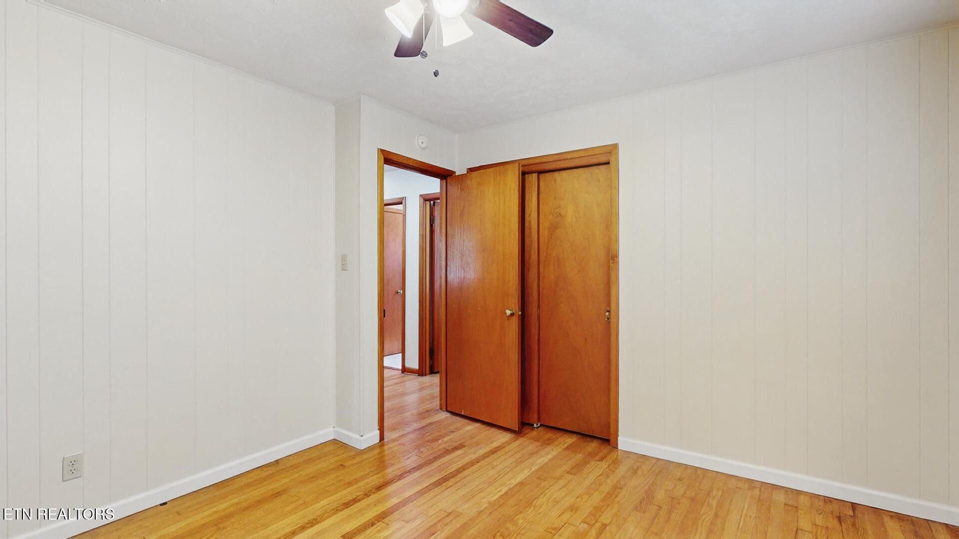4004 Deerfield Road Knoxville, TN 37921 - Photo 18 of 34 a view of an empty room with wooden floor