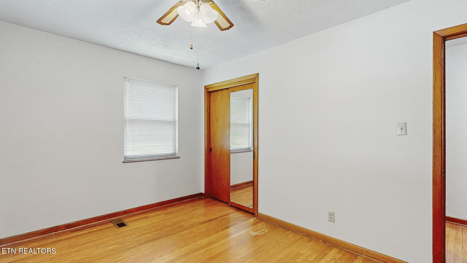 4004 Deerfield Road Knoxville, TN 37921 - Photo 22 of 34 a view of an empty room with a window